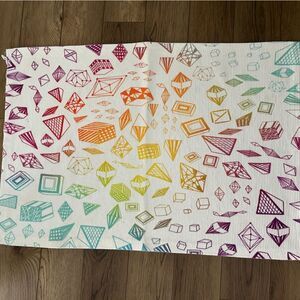 Washable throw rug with colorful ombre geometric print